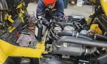 EDCO staff member servicing a car